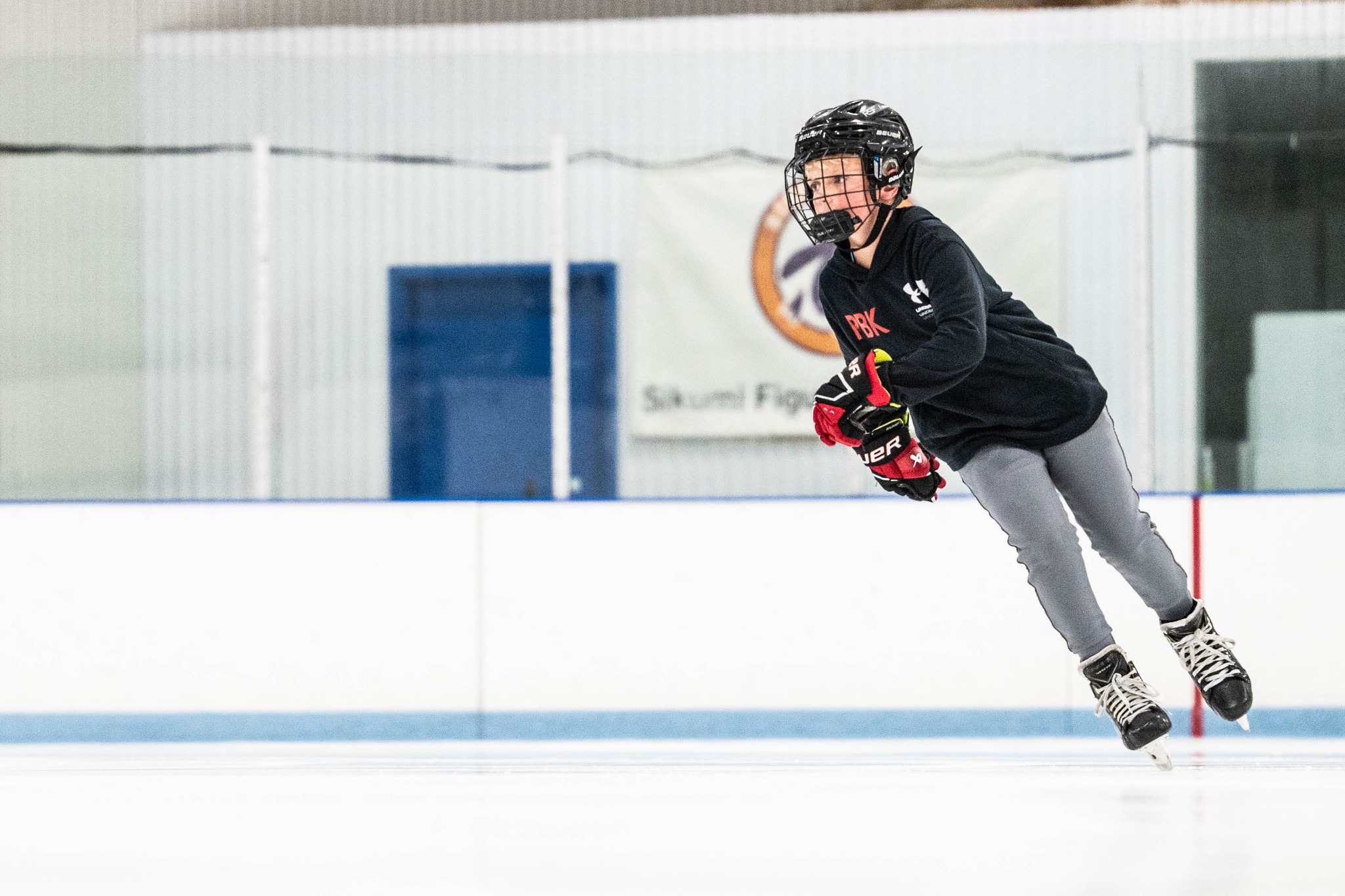 Hockey player working through skating drills